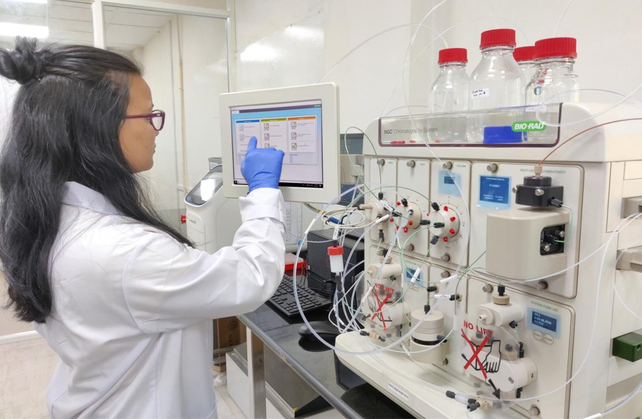 Researcher operating a chromatography system in a Bio Valley laboratory